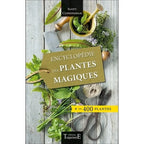 Livre Encyclopédie des plantes magiques de Scott Cunningham avec herbes fraîches et outils de jardinage.