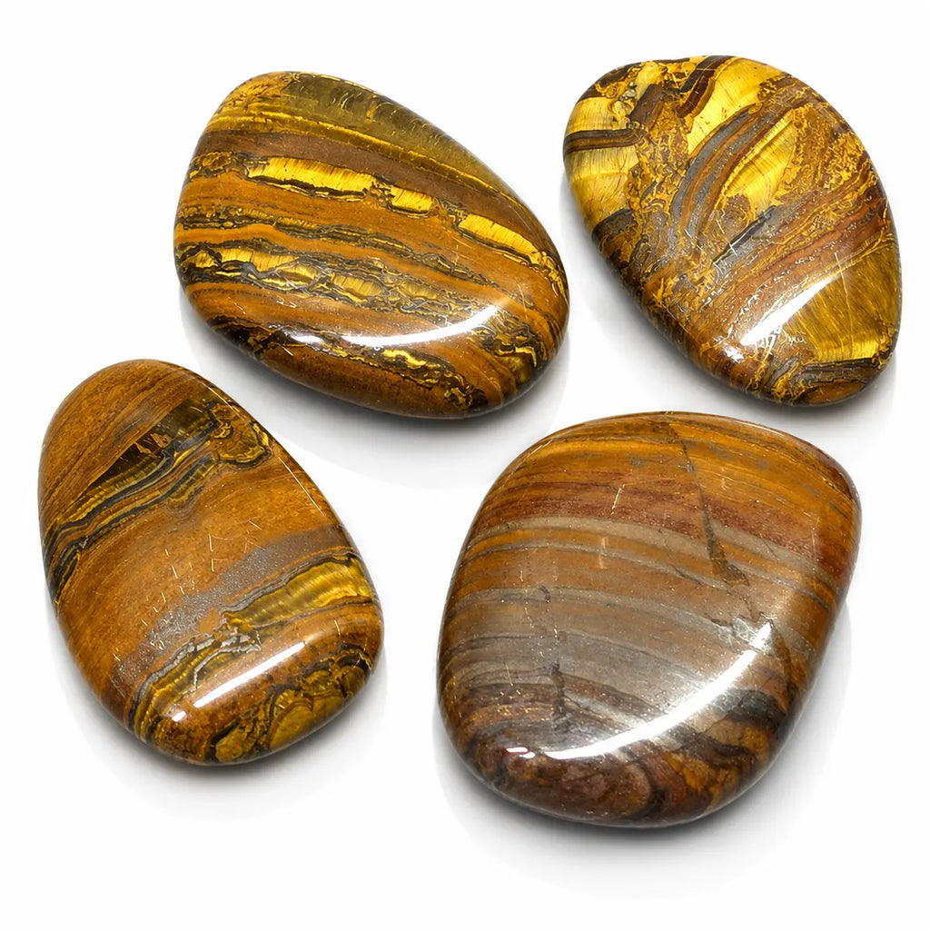 Oeil de fer : lot de quatre galets plats et polis aux nuances chatoyantes de brun, de rouge et de doré brillant.