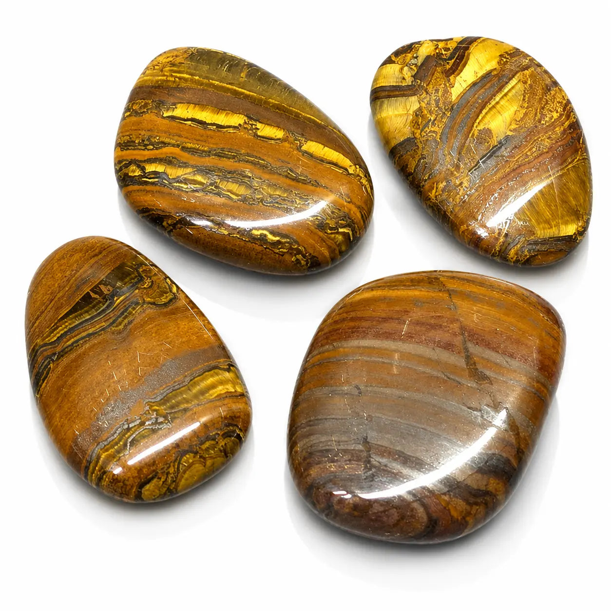 Oeil de fer : lot de quatre galets plats et polis aux nuances chatoyantes de brun, de rouge et de doré brillant.