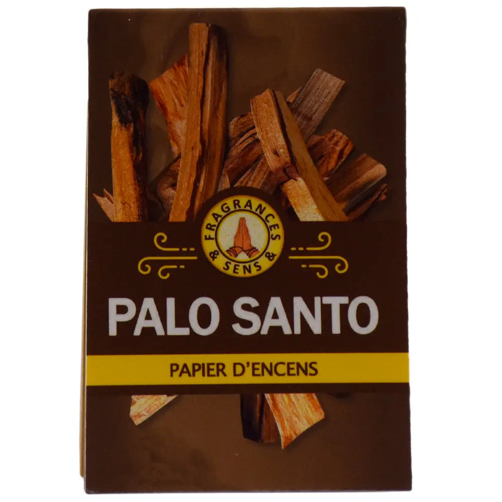La couverture de ce carnet de papier d'encens Fragrances & Sens au Palo Santo est illustrée par des morceaux de bois sacré sur un fond marron.